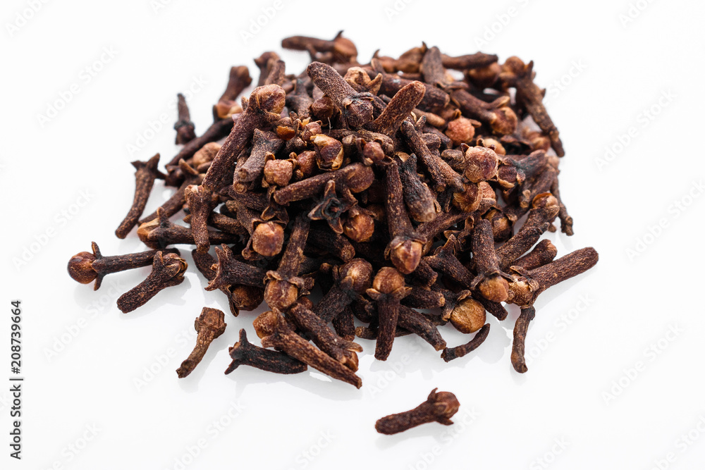 fragrant cloves on a white acrylic background fragrant cloves on a white acrylic background