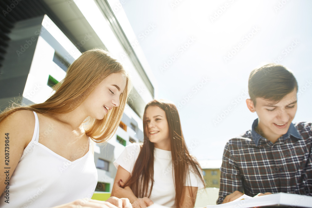 Portrait of three happy high school students Portrait of three happy high school students