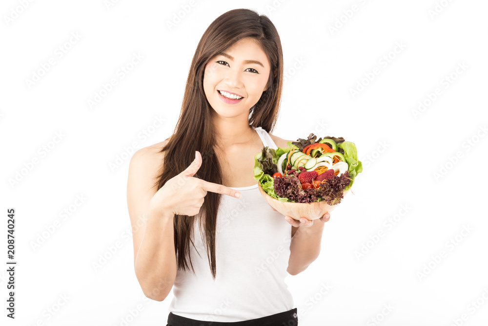 Beautiful Attractive Asian woman smile with white teeth holding fresh salad vegetable in hand feeling so happiness and cheerful whit Healthy Skin,Isolated on white background,Healthcare concept