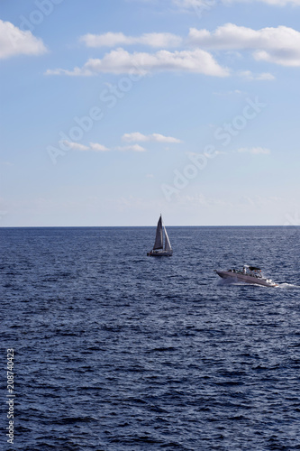 View of a sailboat in the Mediterranean Sea and blue sky on the Spanish coast