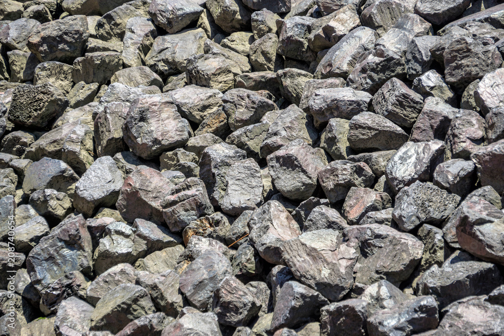 Bulk of coarse gravel on a harbour basin, texture and background