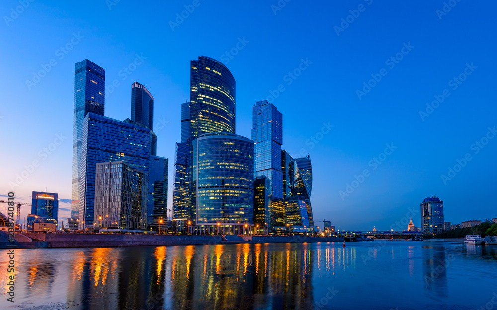 Skyscrapers of Moscow City business center and Moscow river in Moscow at night, Russia