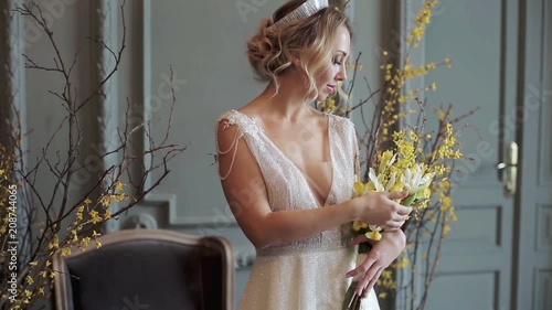 Blonde bride in fashion white wedding dress with makeup