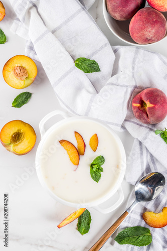 Sweet creamy peach soup  vegan summer food  white marble background copy space