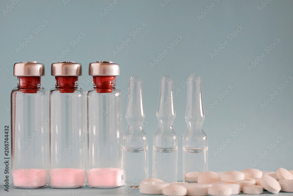 A bottle of medicine and pills A bottle of medicine and pills