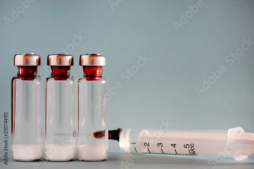 Bottle of medication and syringes