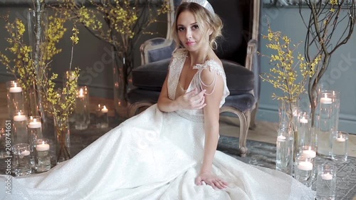 Blonde bride in fashion white wedding dress with makeup