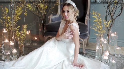 Blonde bride in fashion white wedding dress with makeup