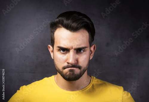 Portrait of young angry man