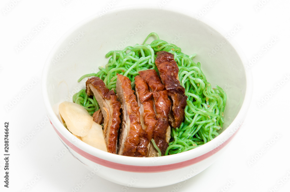 Green noodles with duck in bowl.