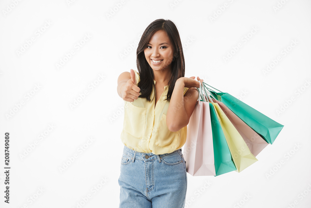 Happy emotional young asian woman showing thumbs up gesture. Happy emotional young asian woman showing thumbs up gesture.
