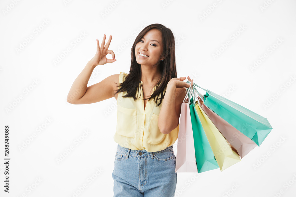Happy emotional young asian woman make ok gesture. Happy emotional young asian woman make ok gesture.