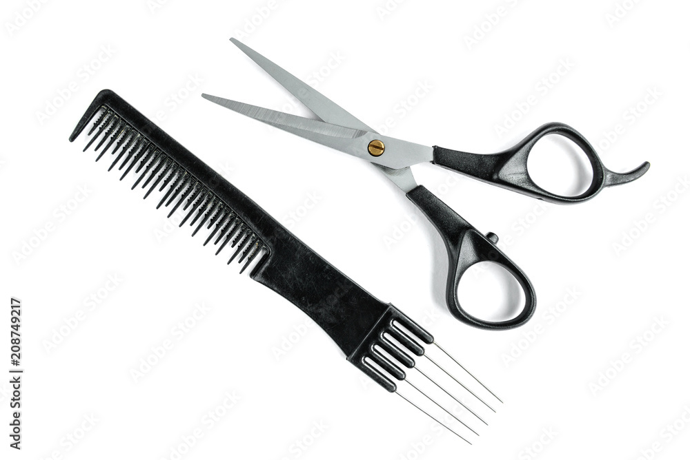 Black hair scissors and comb isolated on white background. Black hair scissors and comb isolated on white background.