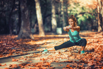 Woman Exercising Outdoors in The Fall