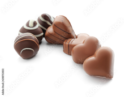 Tasty chocolate candies on white background