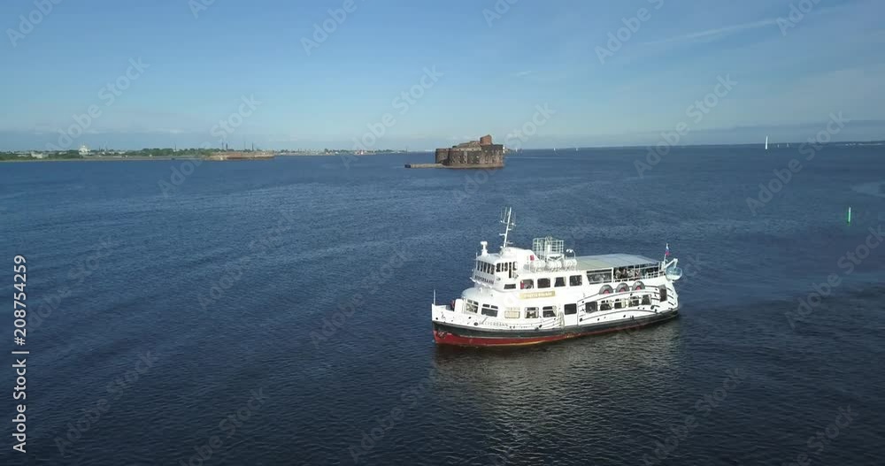 Aerial view of a small white passenger ship going along the Finnish Gulf Aerial view of a small white passenger ship going along the Finnish Gulf