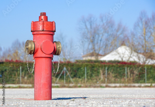 Old red fire hydrant in the street. Fire hidrant for emergency fire access