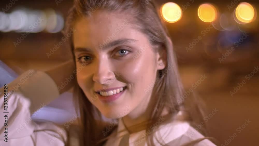 Young sweet girl is is watching at camera in evening in summer, touching her hair, flirt conception Young sweet girl is is watching at camera in evening in summer, touching her hair, flirt conception
