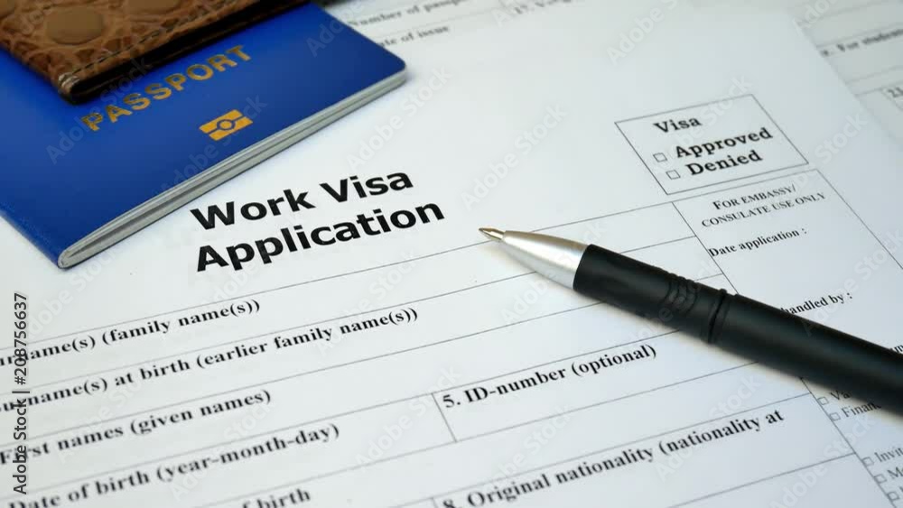 Work Visa application form with passport and pen. Document with passport, apply and permission for foreigner country Work Visa application form with passport and pen. Document with passport, apply and permission for foreigner country