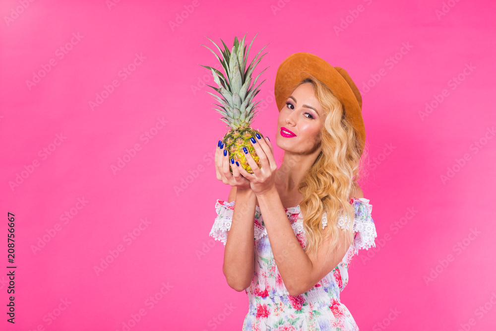 Fashion portrait young beautiful woman with pineapple over pink background with copyspace. Fashion portrait young beautiful woman with pineapple over pink background with copyspace.