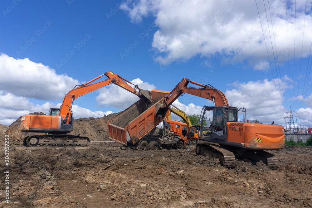 excavators pick up a fallen truck excavators pick up a fallen truck