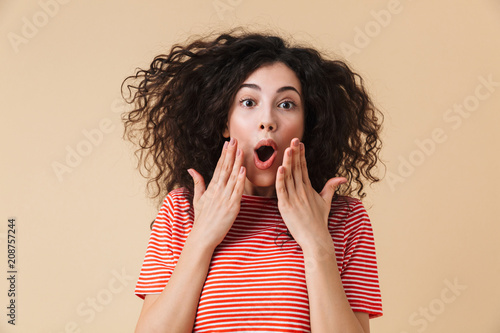 Excited shocked young woman isolated