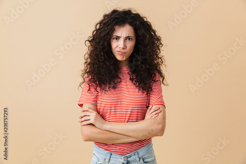 Displeased young woman looking camera.