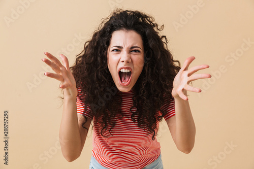 Fotografi Agressive displeased screaming young woman