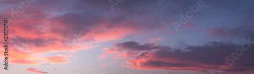 Dramatic colorful dawn/dusk sky, with dark clouds, panorama background.