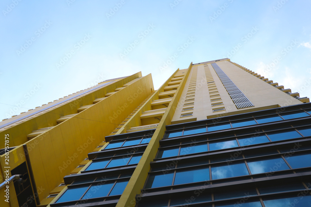 yellow high building with blue sky yellow high building with blue sky