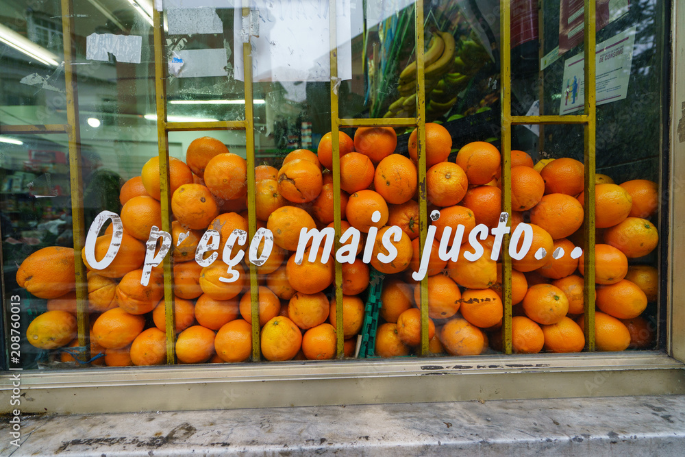 A lot of tasty oranges at the window