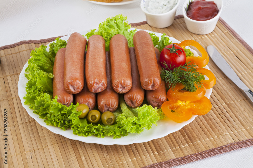 Sausages smoked with tomatoes, cucumbers and greens. Served with black or white bread. Sausages smoked with tomatoes, cucumbers and greens. Served with black or white bread.