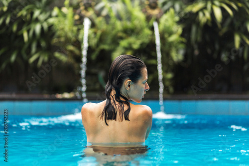 Woman posing in swimpool