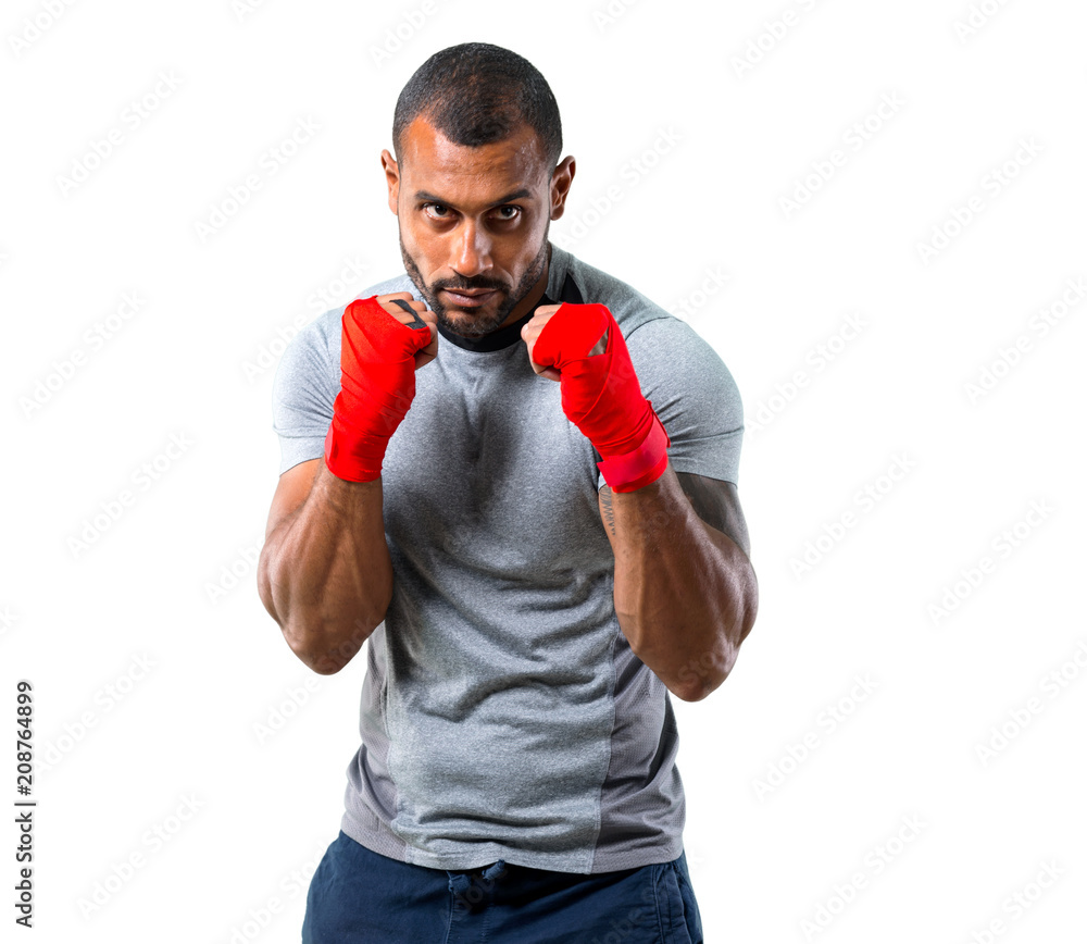 Strong sport man with boxing tapes fighting on isolated white background Strong sport man with boxing tapes fighting on isolated white background