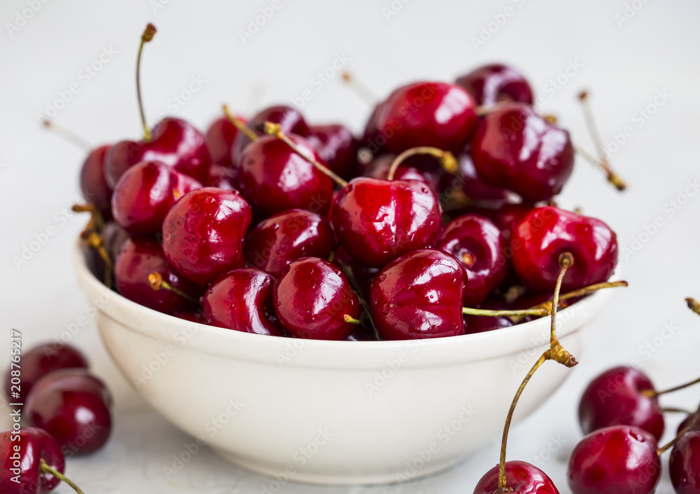 Fresh organic tasty cherries in a bowl.Summer ripe fruits Fresh organic tasty cherries in a bowl.Summer ripe fruits