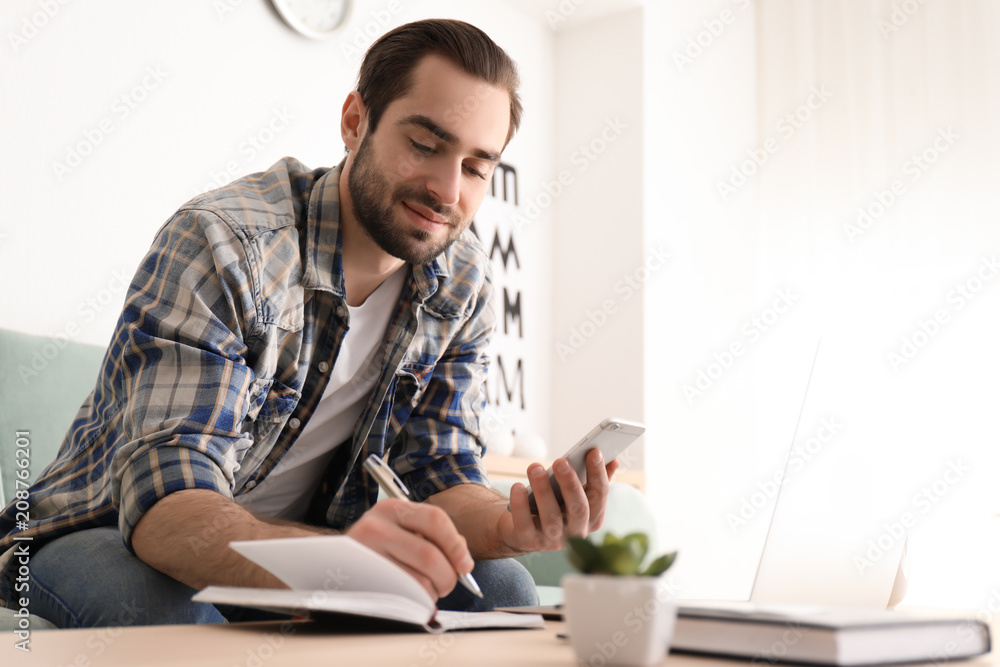 Male freelancer working in home office Male freelancer working in home office