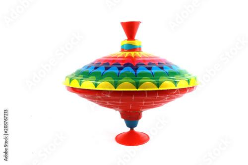 Schilderij op canvas A Vintage 1970s Children's Spinning Top in Rainbow Colours on White