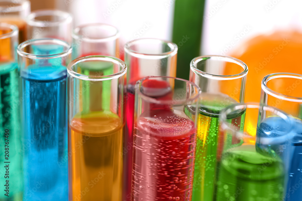 Many test tubes with colorful liquids, closeup Many test tubes with colorful liquids, closeup