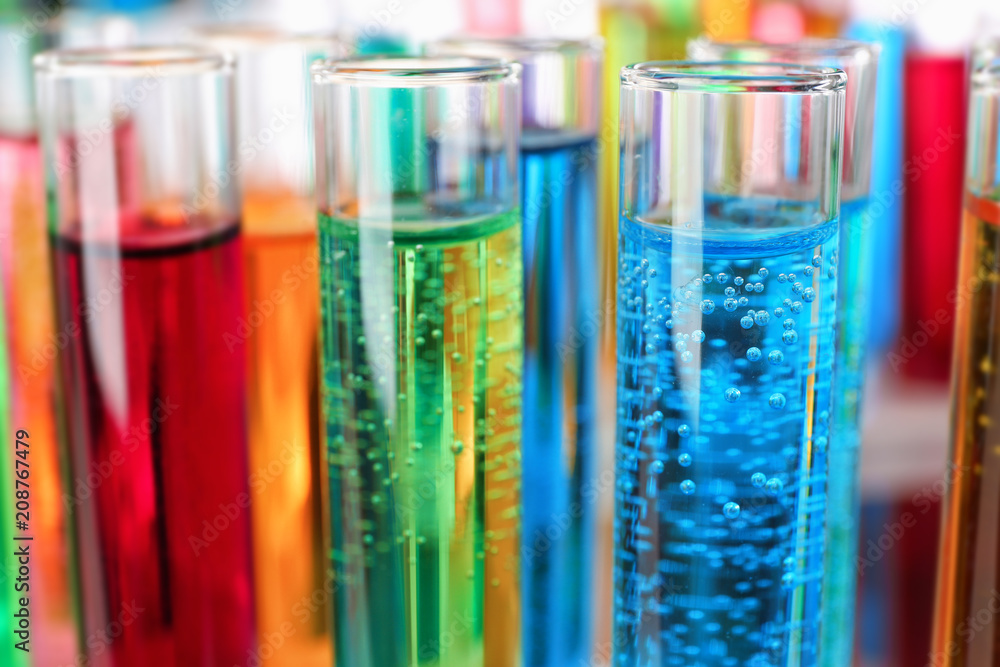 Many test tubes with colorful liquids, closeup Many test tubes with colorful liquids, closeup