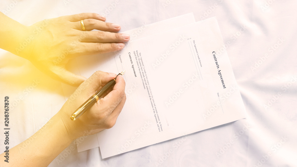 contract agreement document for sign with pen and hand contract agreement document for sign with pen and hand