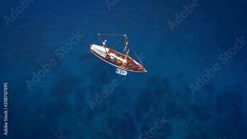Yacht sailing at windy day. Freedom of Yachting at opened sea / ocean. Aerial, drone video.