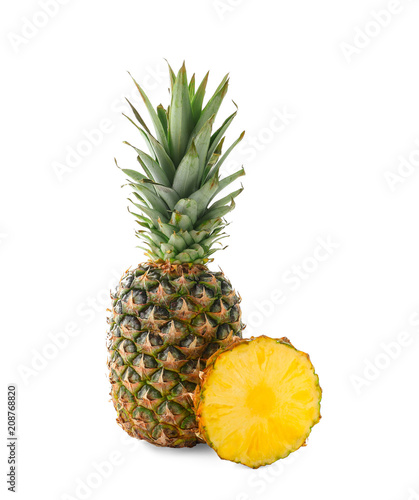 Delicious pineapple and slice on white background