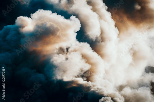 Dramatic dark clouds or smoke from the fire, background
