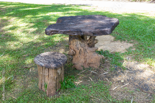 Table and chairs made from wood the lawn in the park