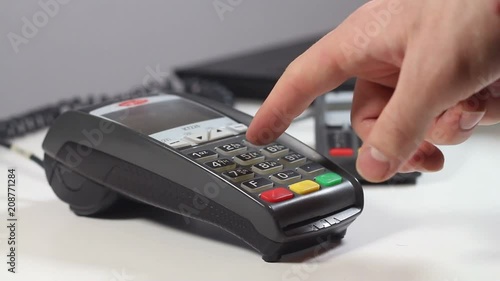 person conducts a credit card on the terminal