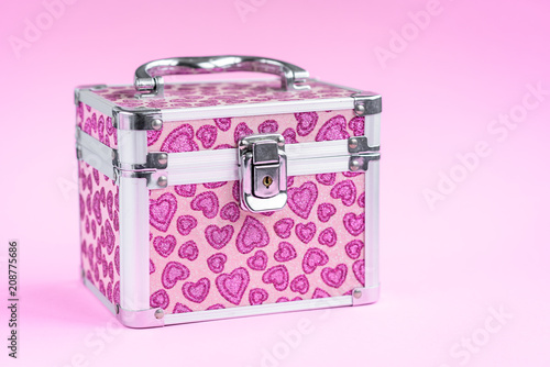Pink jewelry box isolated on pink background.
