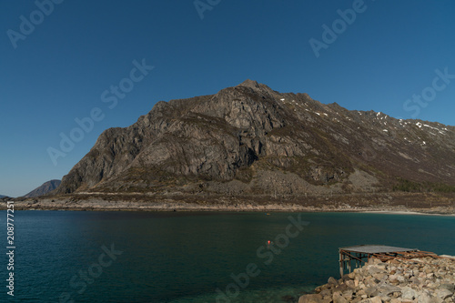 Aerial view over the Rorvikstranda beach and Gimsoystraumen fjord near Henningsvaer at Lofoten Islands / Norway photo