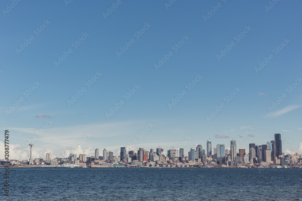 Entire Seattle city skyline from Alki Beach in Washington with Space Needle