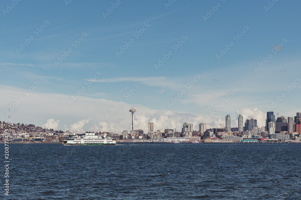 Seattle city skyline from Alki Beach in Washington with ferry and Space Needle