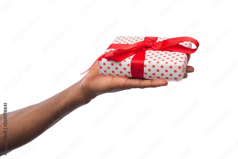 Obraz premium Black man holding gift box isolated on white background